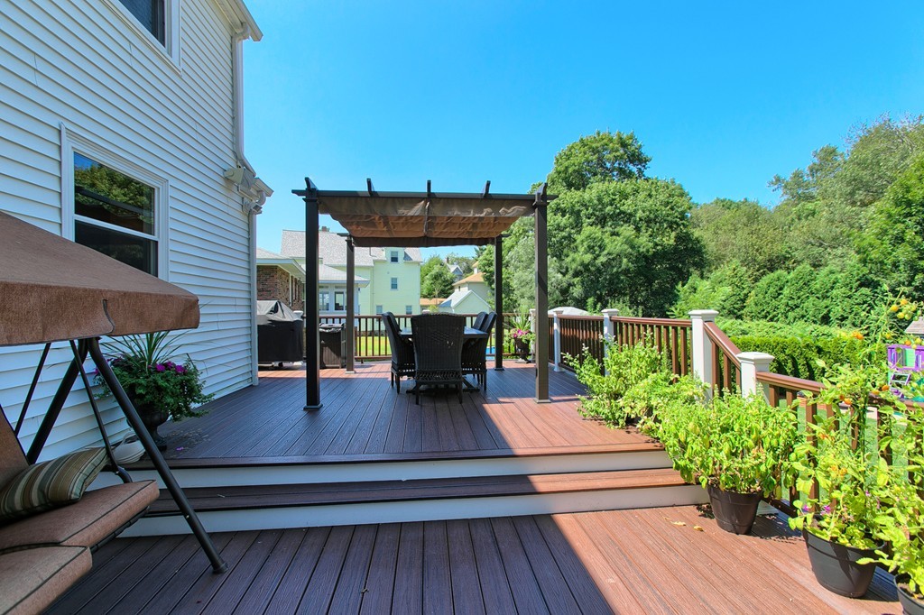 29 Spring Street Wakefield, MA 01880 - Photo 22 of 30 a view of a table and chairs in patio with potted plants
