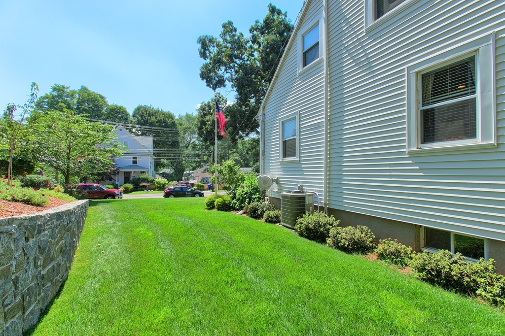 29 Spring Street Wakefield, MA 01880 - Photo 27 of 30 a flower plants in front of a house