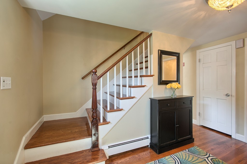 29 Spring Street Wakefield, MA 01880 - Photo 3 of 30 a view of entryway and hall with wooden floor