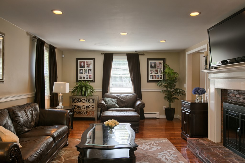29 Spring Street Wakefield, MA 01880 - Photo 6 of 30 a living room with furniture and a flat screen tv