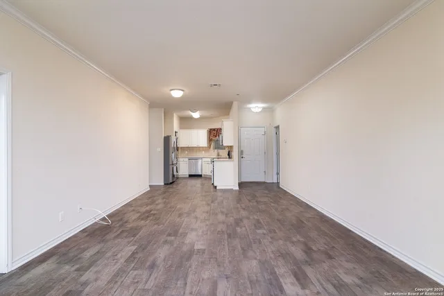 a kitchen with stainless steel appliances granite countertop a refrigerator and a stove