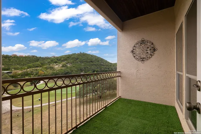 a view of a balcony with an outdoor space
