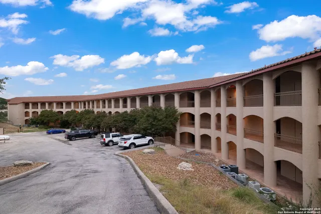 a view of a building with sitting area