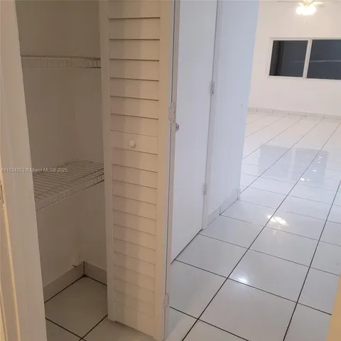 a bathroom with a white bathtub and a shower