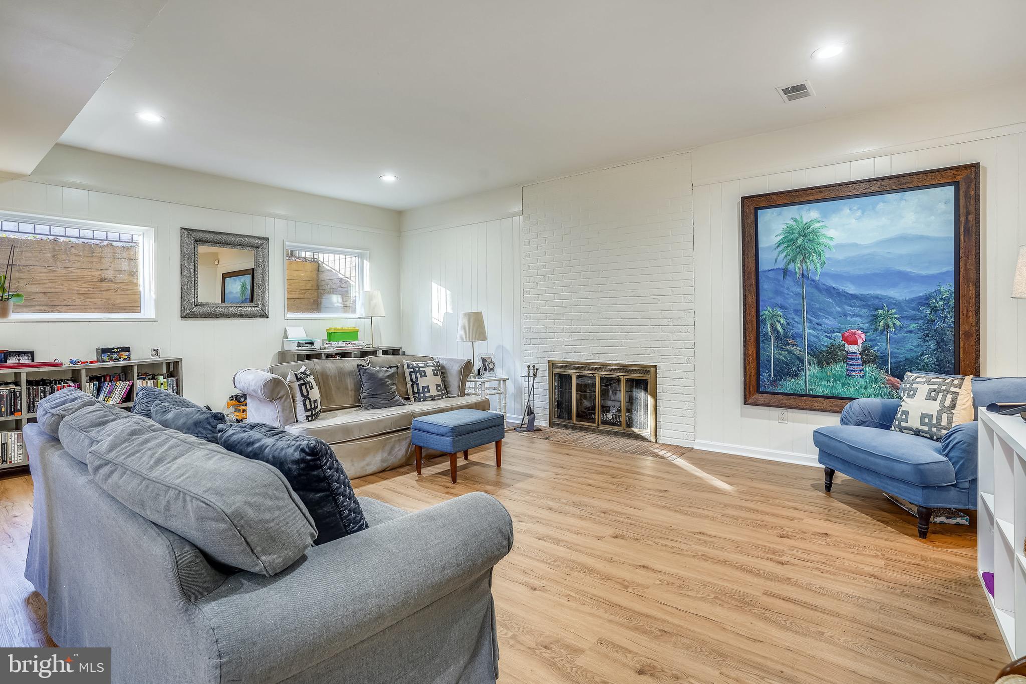 4106 North RoundHill Road Arlington, VA 22207 - Photo 35 of 55 Downstairs naturally lit living area and fireplace