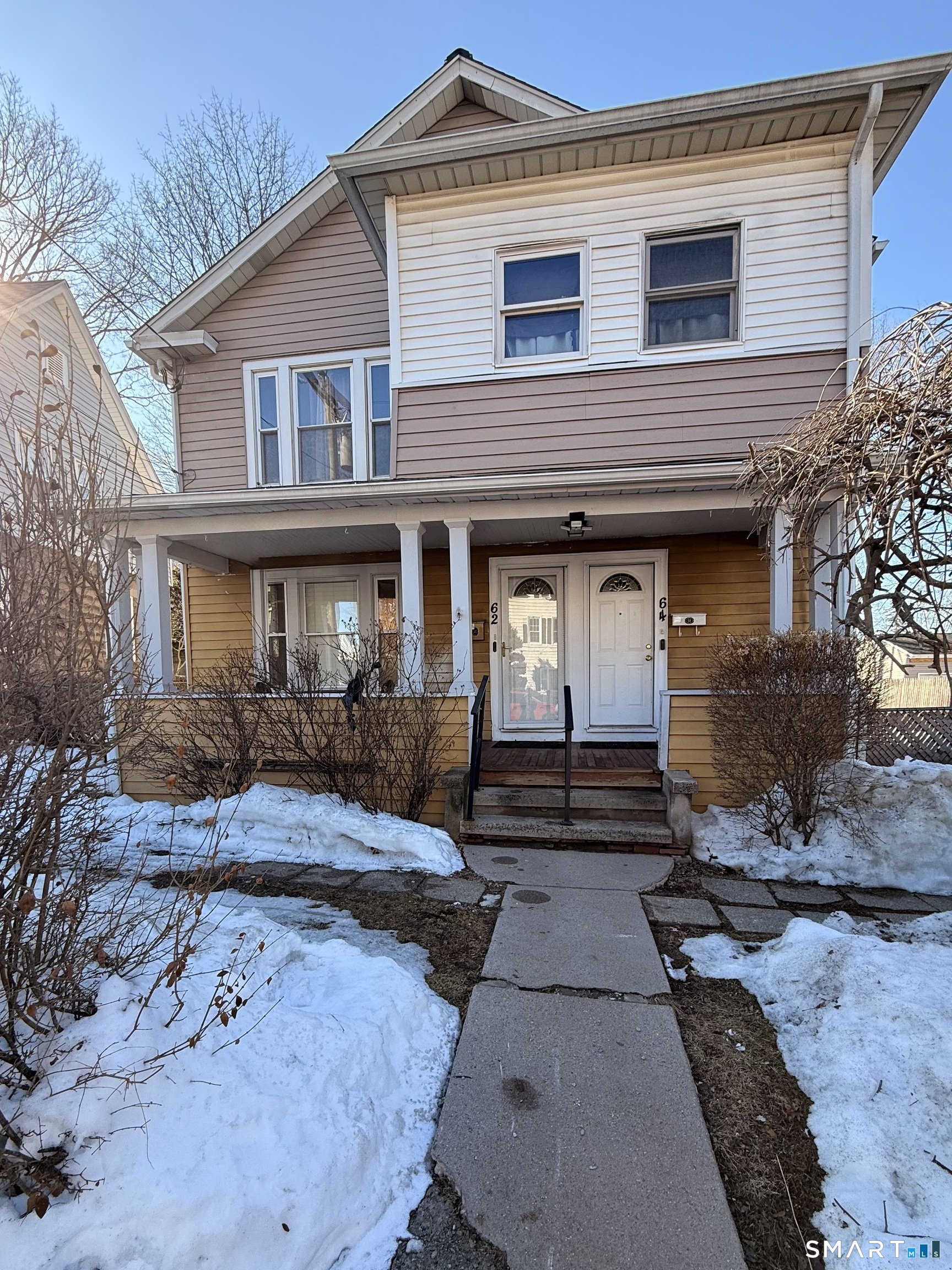 62 Putnam Street Meriden, CT 06450 - Photo 1 of 7 a front view of a house with garden