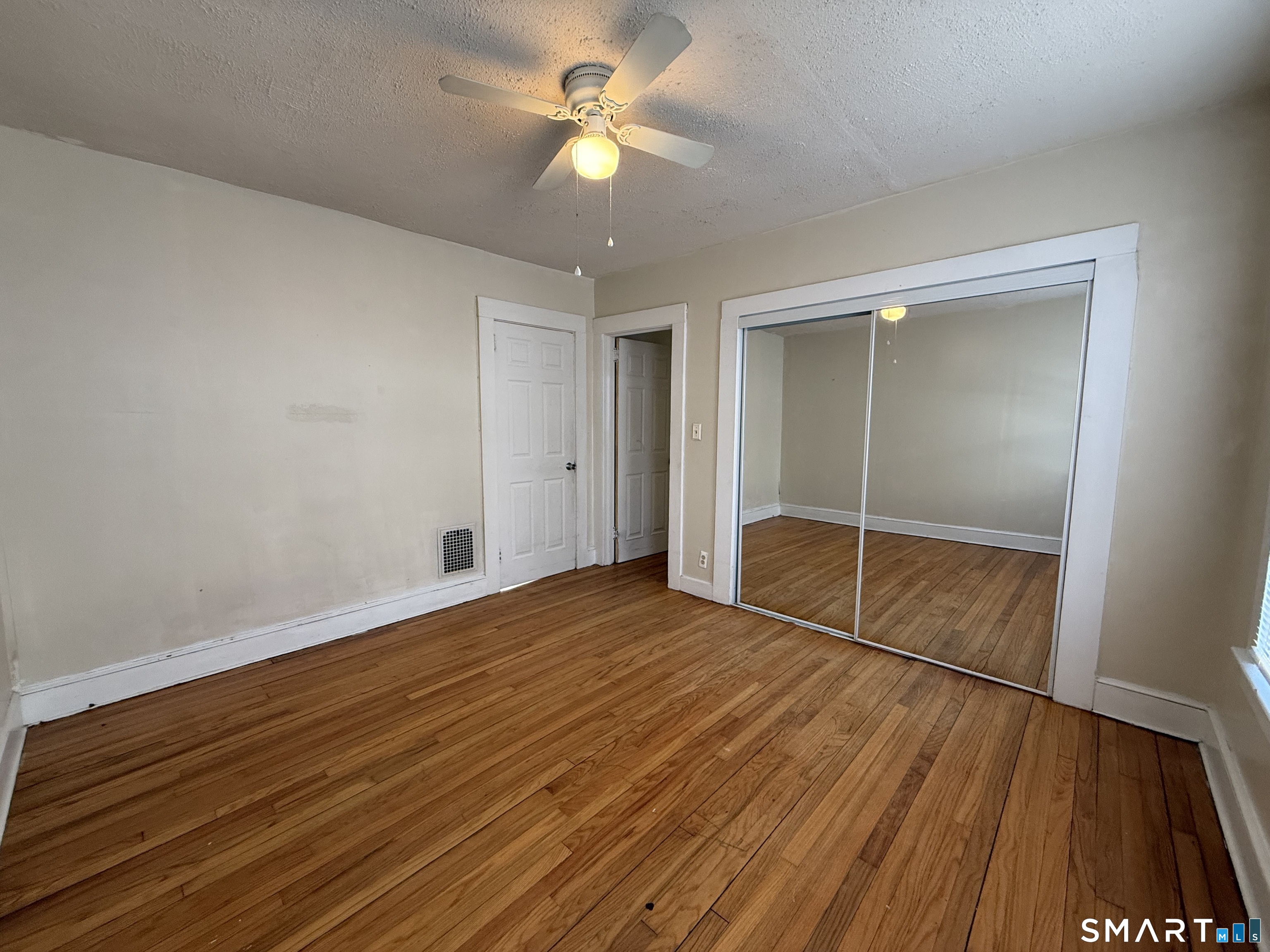 62 Putnam Street Meriden, CT 06450 - Photo 6 of 7 wooden floor in an empty room