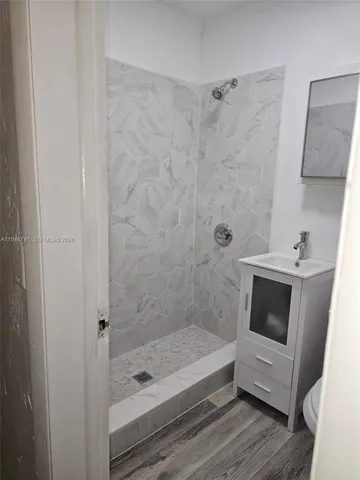 a bathroom with a bathtub and a sink