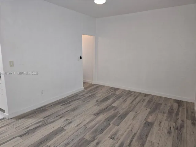 a view of small space with wooden floor