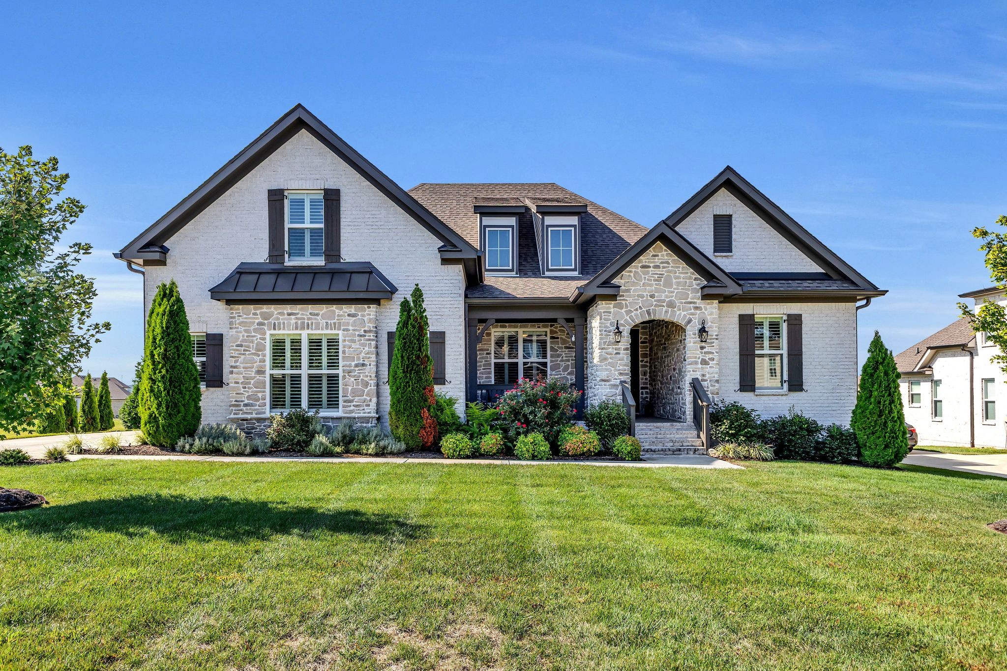1007 Abbey Rd Way Spring Hill, TN 37174 - Photo 1 of 54 a front view of a house with a yard