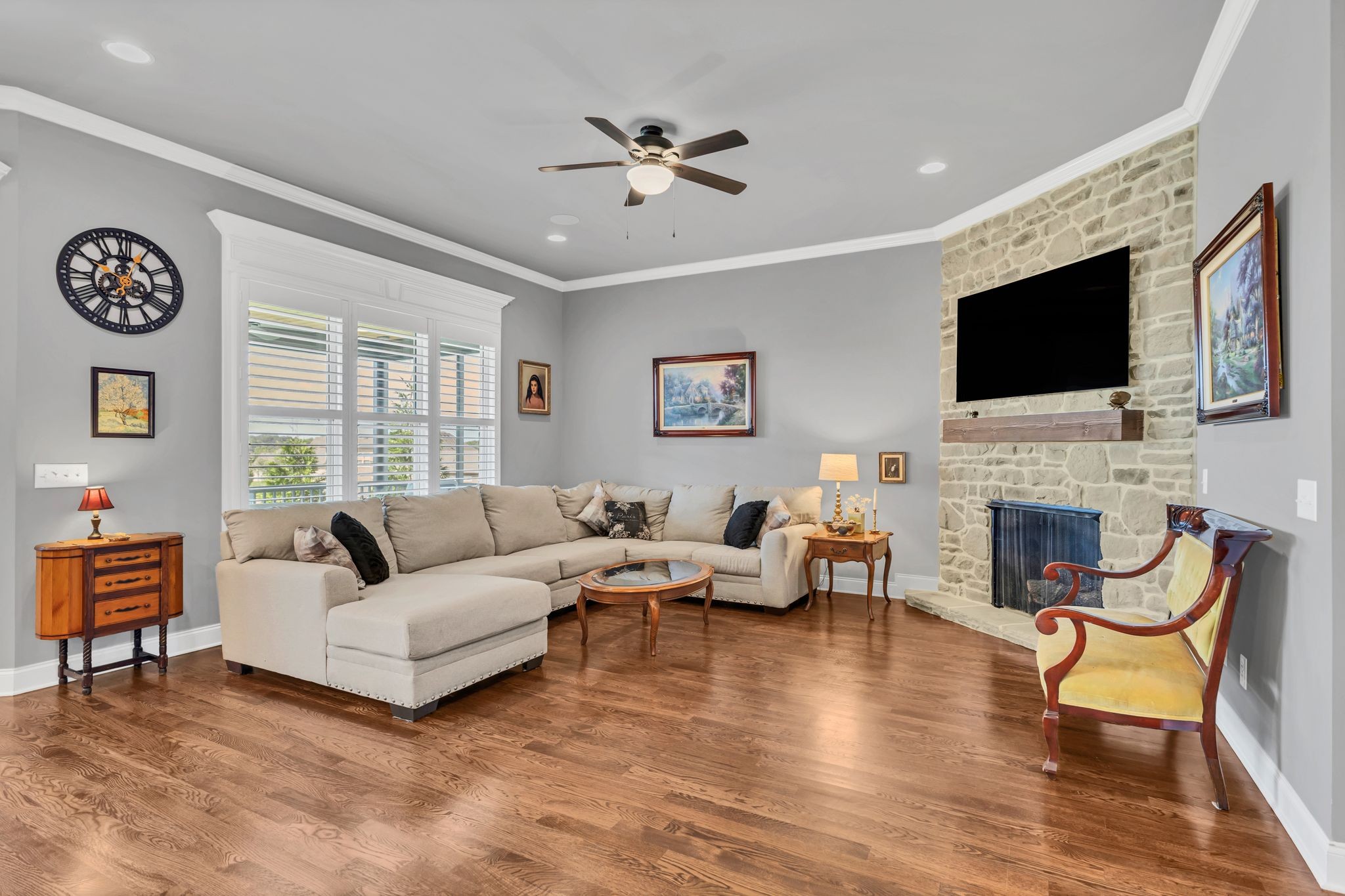 1007 Abbey Rd Way Spring Hill, TN 37174 - Photo 11 of 54 a living room with furniture a fireplace and a flat screen tv