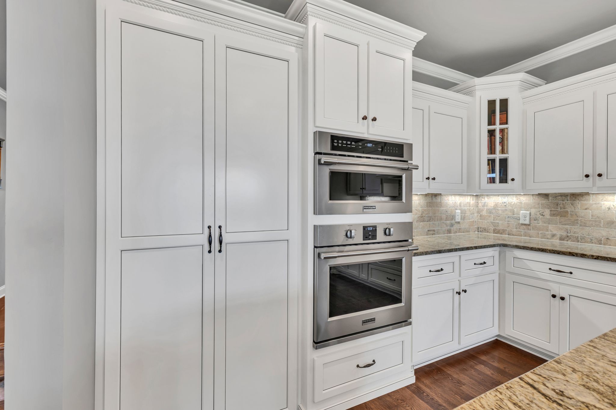 1007 Abbey Rd Way Spring Hill, TN 37174 - Photo 18 of 54 a kitchen with stainless steel appliances white cabinets and a stove
