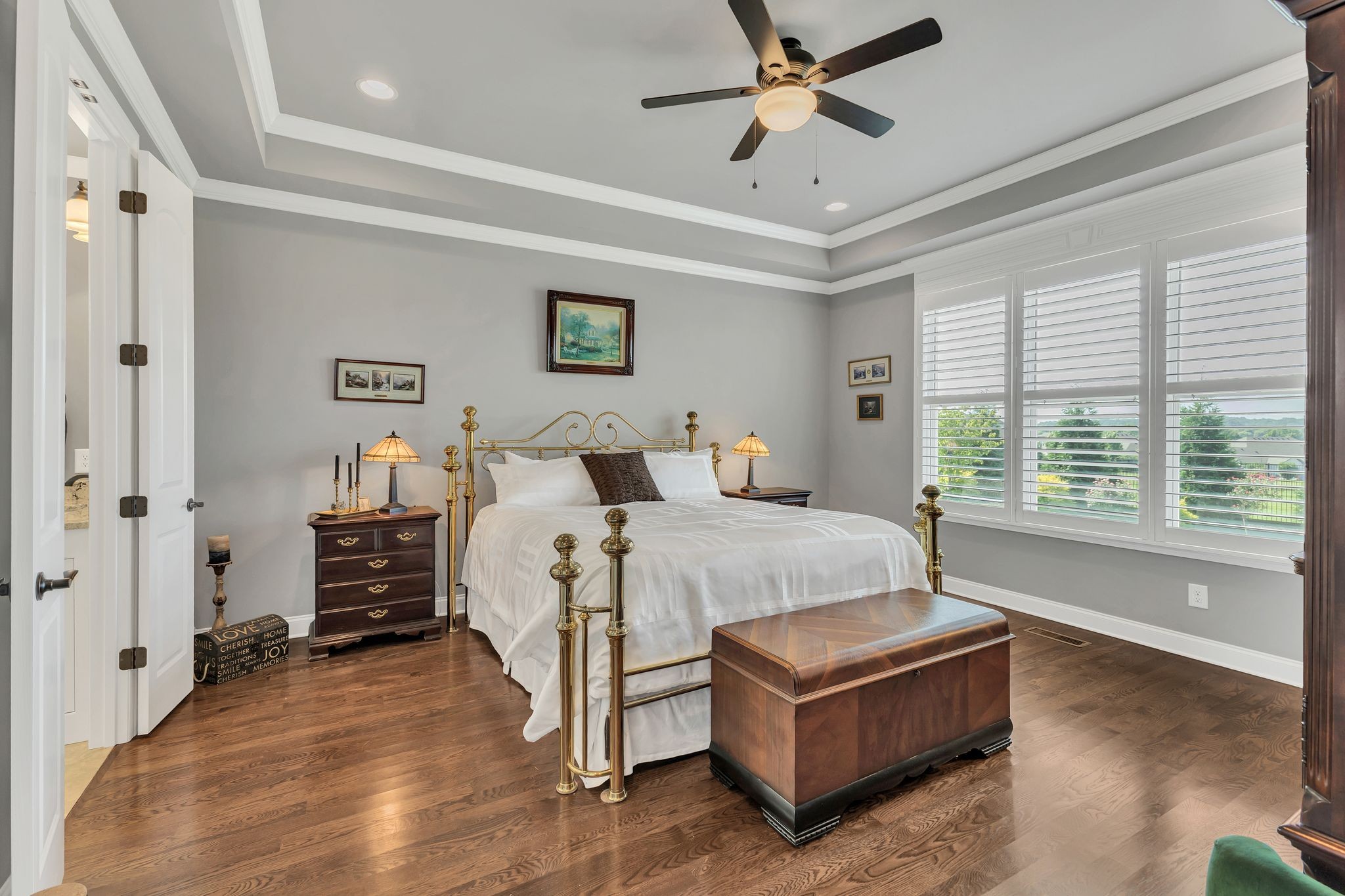 1007 Abbey Rd Way Spring Hill, TN 37174 - Photo 23 of 54 a spacious bedroom with a bed and a chandelier