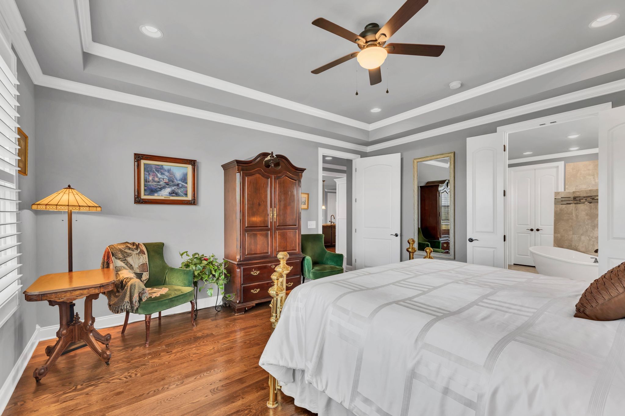 1007 Abbey Rd Way Spring Hill, TN 37174 - Photo 24 of 54 a bedroom with furniture and a chandelier