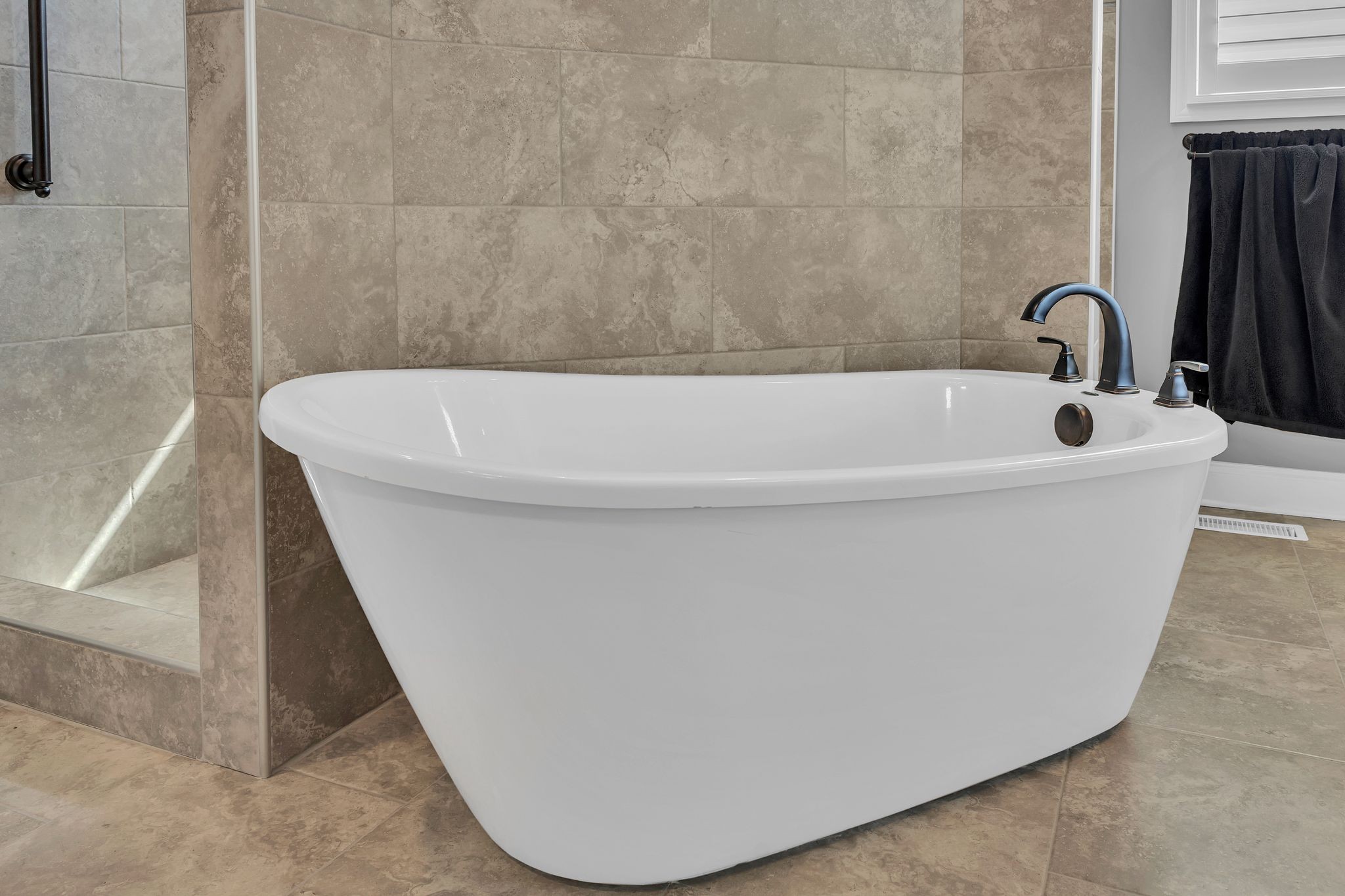 1007 Abbey Rd Way Spring Hill, TN 37174 - Photo 26 of 54 a view of a bathtub in a bathroom