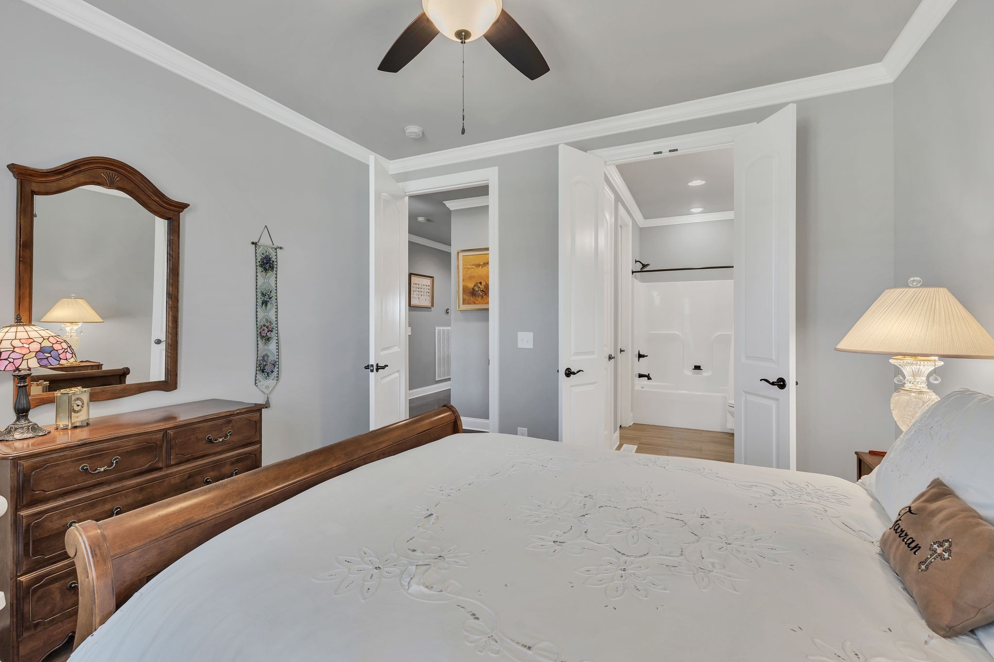 1007 Abbey Rd Way Spring Hill, TN 37174 - Photo 33 of 54 a bedroom with a bed and a chandelier