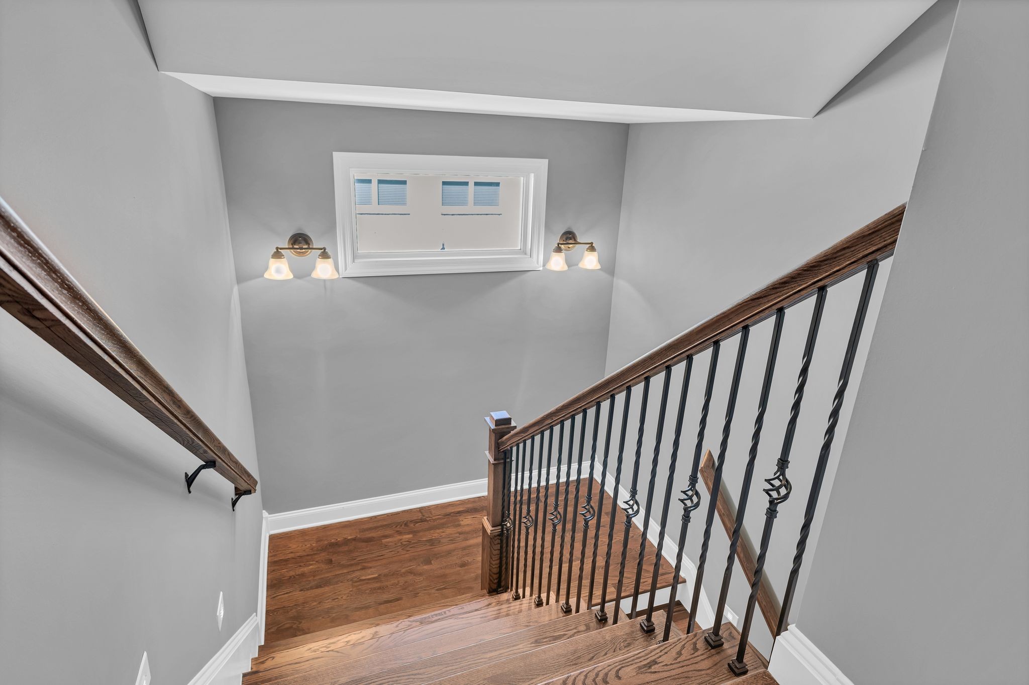 1007 Abbey Rd Way Spring Hill, TN 37174 - Photo 35 of 54 a view of a hallway with wooden floor and stairs