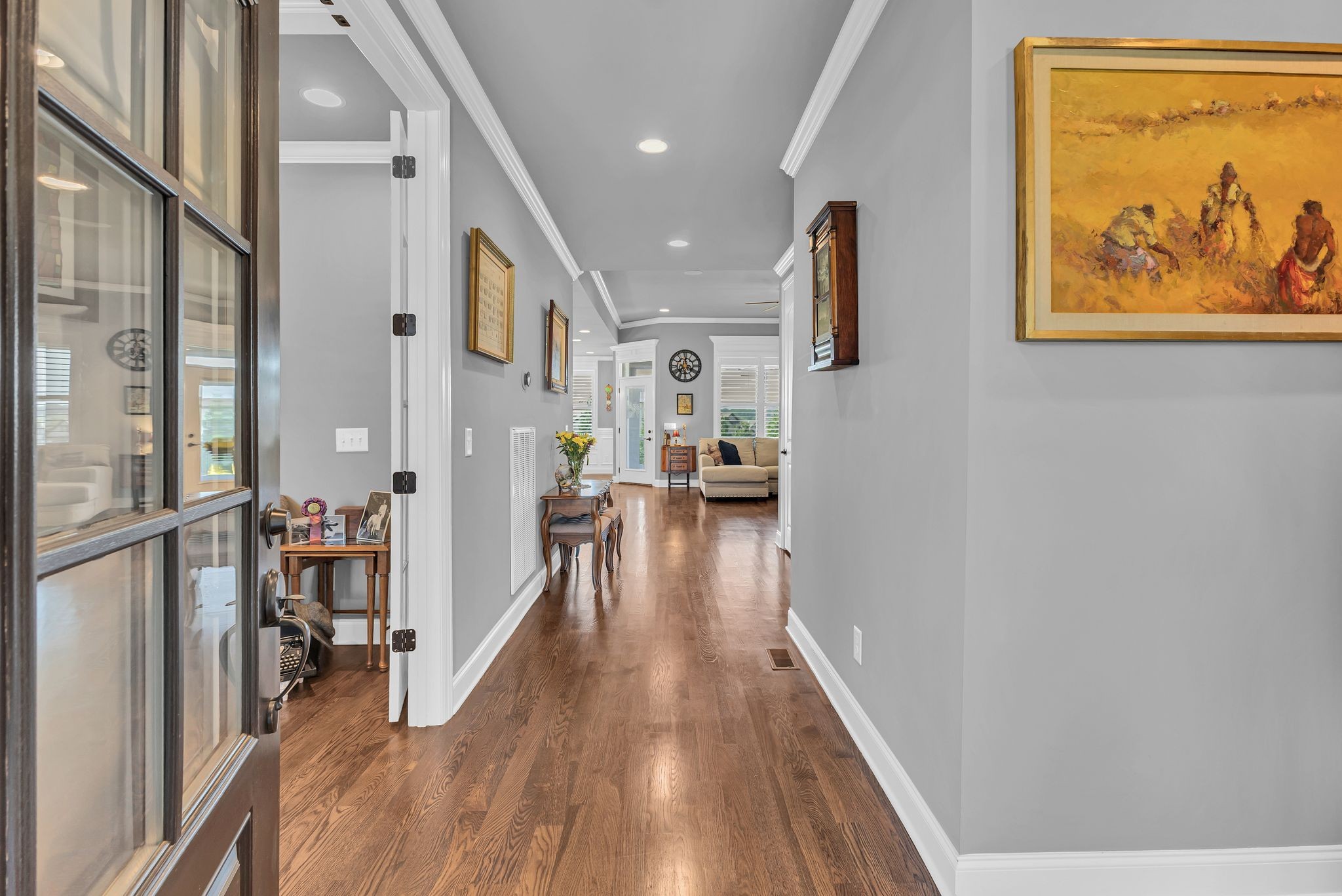 1007 Abbey Rd Way Spring Hill, TN 37174 - Photo 6 of 54 a view of a hallway with wooden floor and staircase