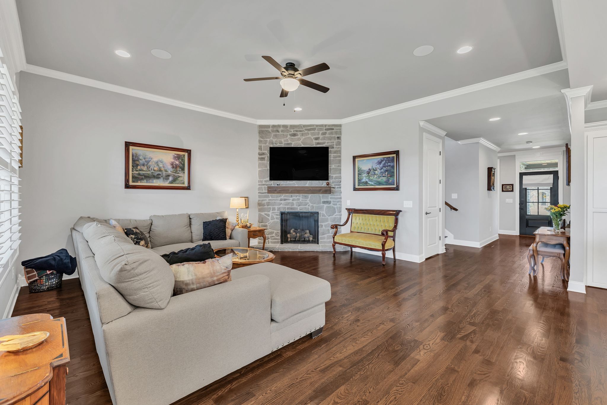1007 Abbey Rd Way Spring Hill, TN 37174 - Photo 10 of 54 a living room with furniture and a flat screen tv