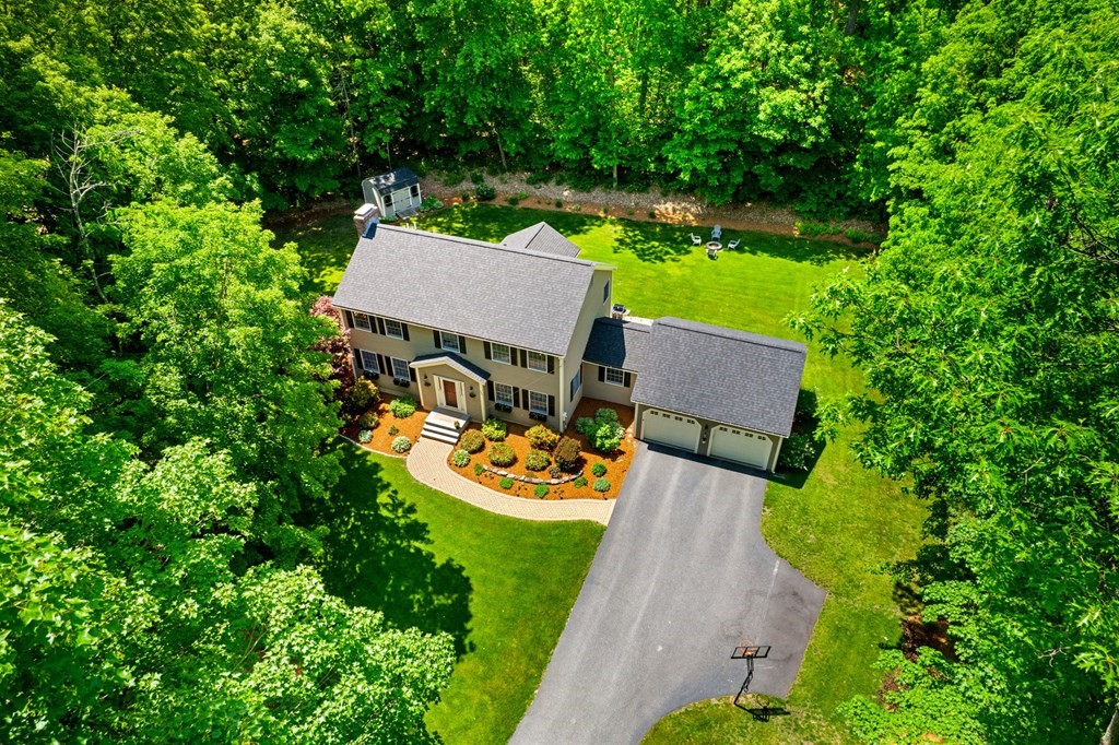 243 Hill Road Groton, MA 01450 - Photo 28 of 30 an aerial view of a house with garden space and sitting area