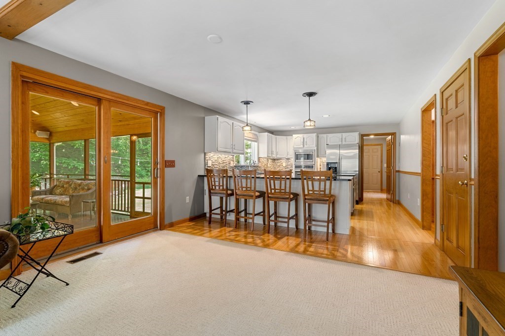 243 Hill Road Groton, MA 01450 - Photo 6 of 30 a room with furniture and a table