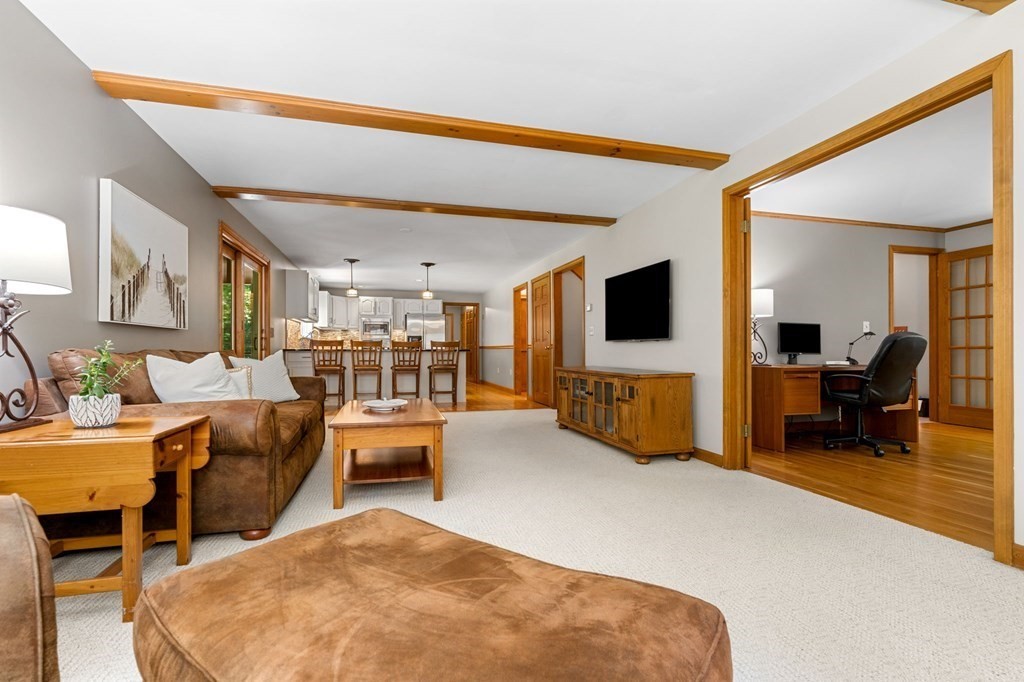 243 Hill Road Groton, MA 01450 - Photo 7 of 30 a living room with furniture and a flat screen tv