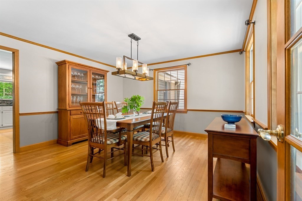 243 Hill Road Groton, MA 01450 - Photo 9 of 30 a view of a dining room with furniture window and wooden floor
