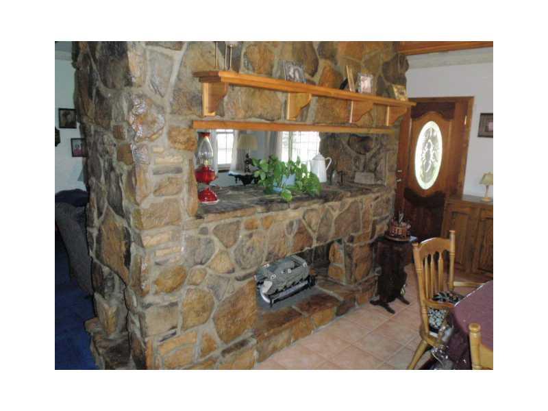 220 Riemer Road Sarver, PA 16055 - Photo 9 of 24 Other. STONE FIREPLACE THAT SEPARATES THE LIVING ROOM AND DINING ROOM... GAS LOGS THAT HAVE ACCESS FROM BOTH ROOMS... ONE OF THE MOST BEAUTIFUL FIREPLACES THAT I HAVE EVER SEEN..