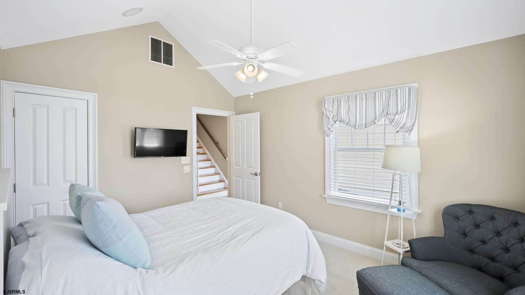 23 Walnut Road Ocean City, NJ 08226 - Photo 25 of 47 a bedroom with a bed a couch and a window