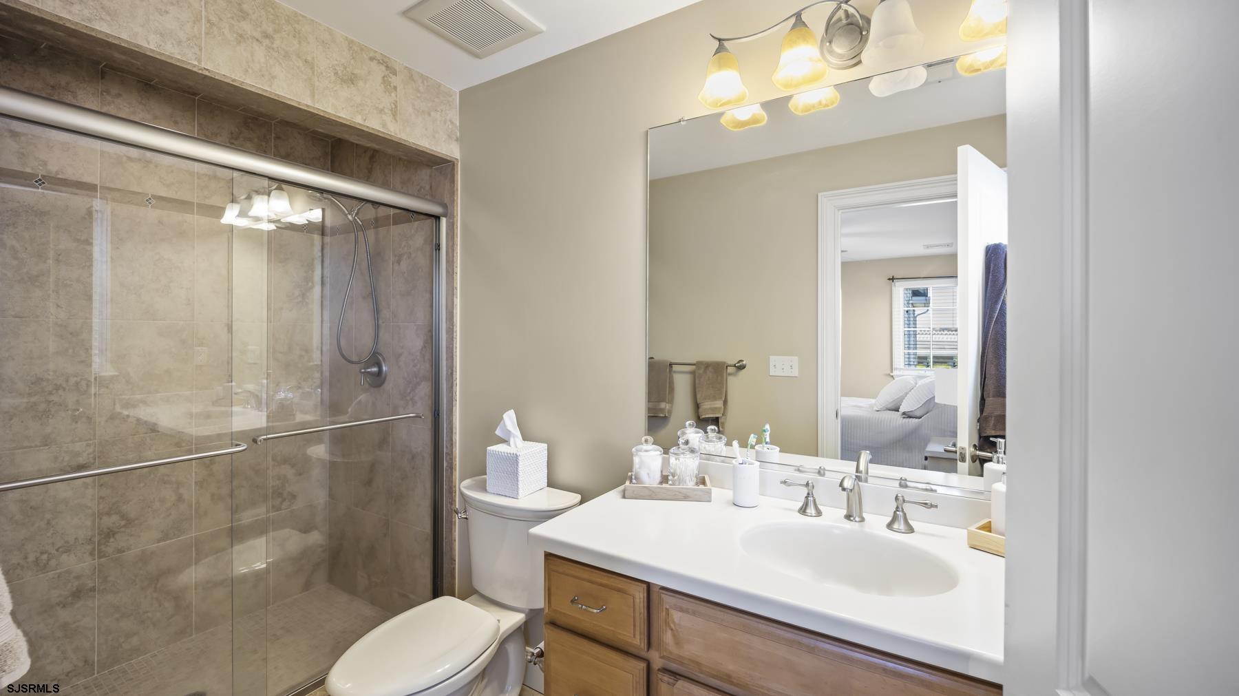 23 Walnut Road Ocean City, NJ 08226 - Photo 28 of 47 a bathroom with a sink toilet and shower