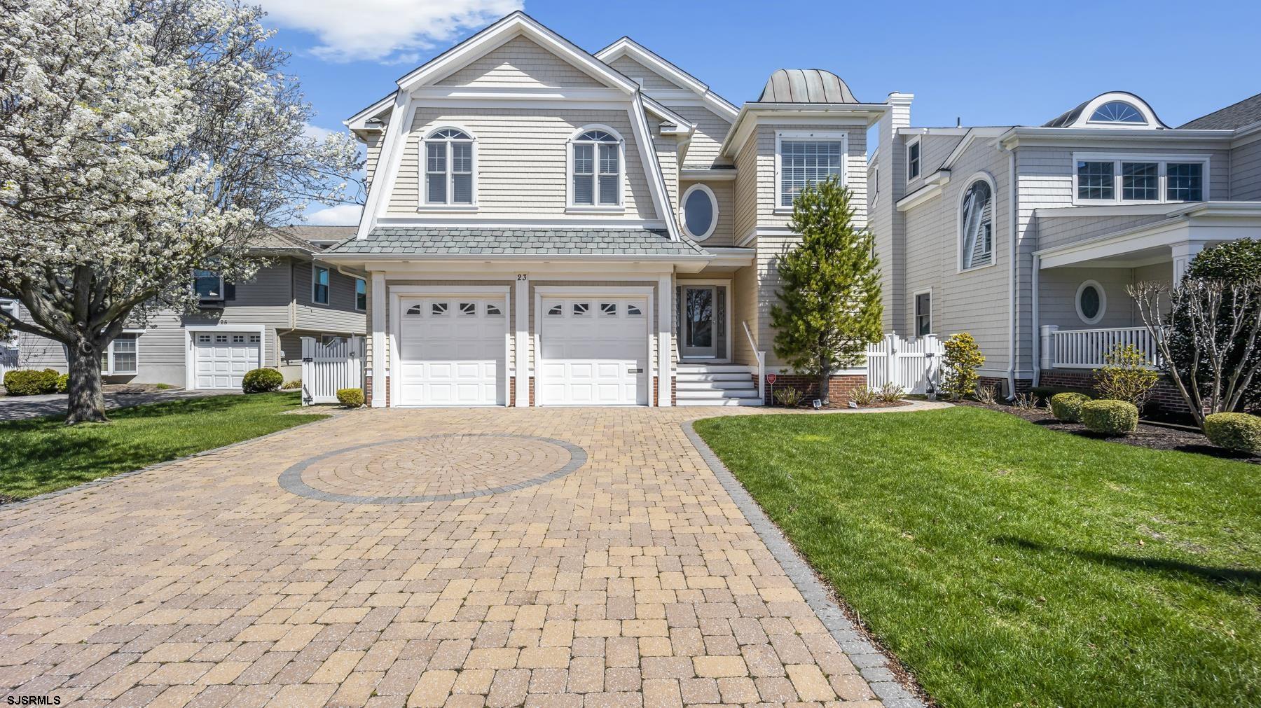 23 Walnut Road Ocean City, NJ 08226 - Photo 3 of 47 a front view of a house with a yard and garage