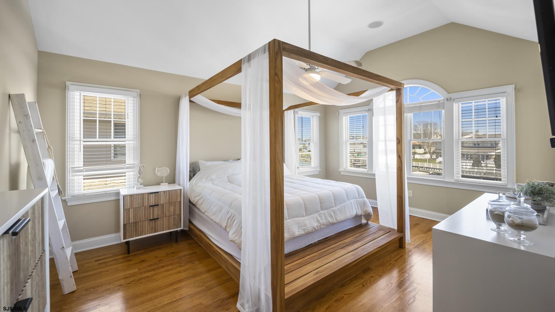 23 Walnut Road Ocean City, NJ 08226 - Photo 36 of 47 a bedroom with a bed and a large window with the outer view