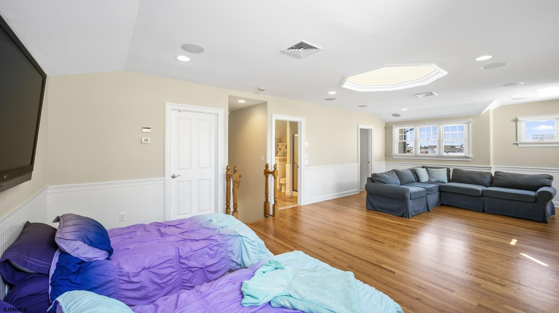 23 Walnut Road Ocean City, NJ 08226 - Photo 42 of 47 a spacious bedroom with a bed and furniture