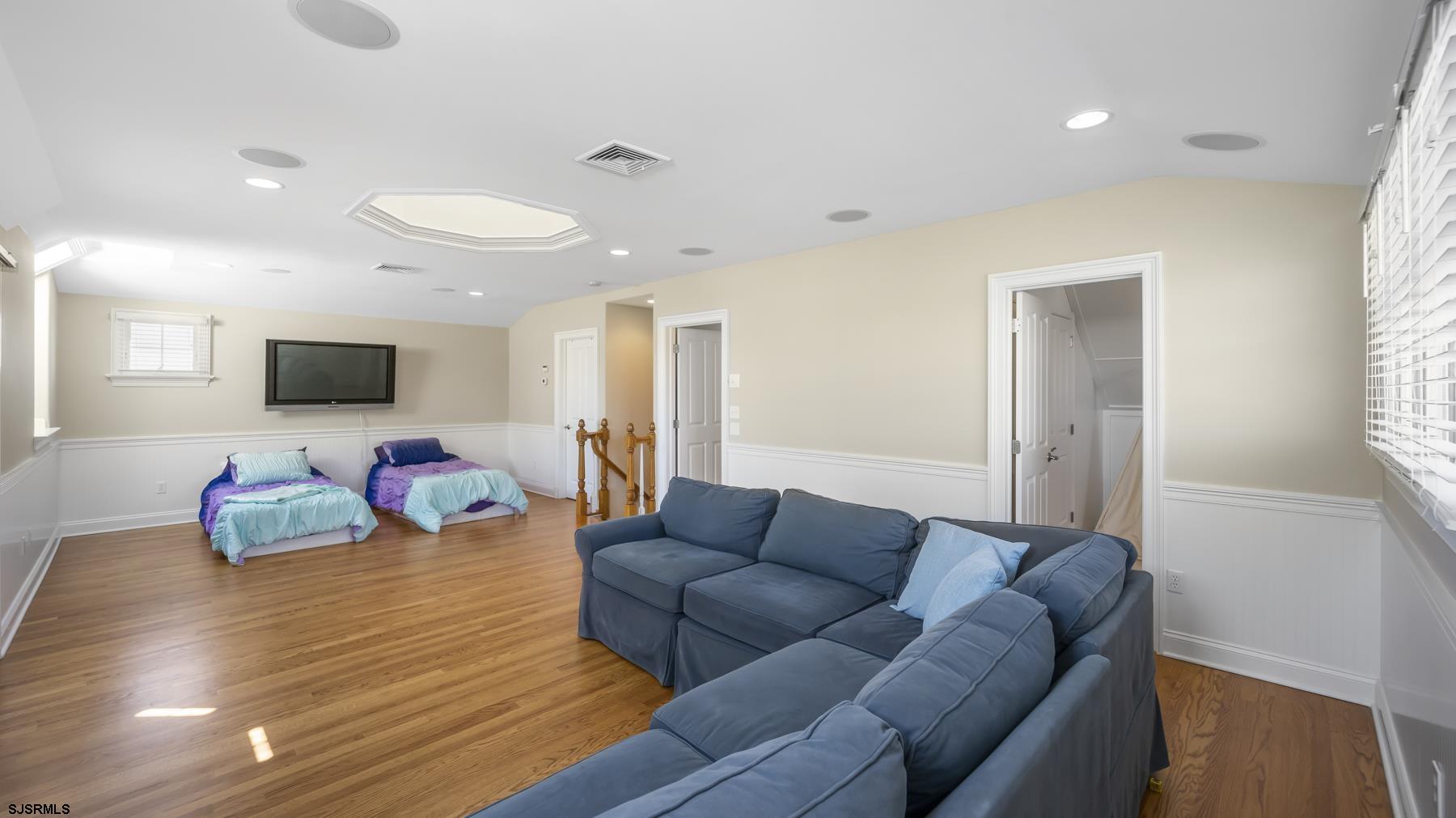 23 Walnut Road Ocean City, NJ 08226 - Photo 43 of 47 a living room with furniture and a flat screen tv