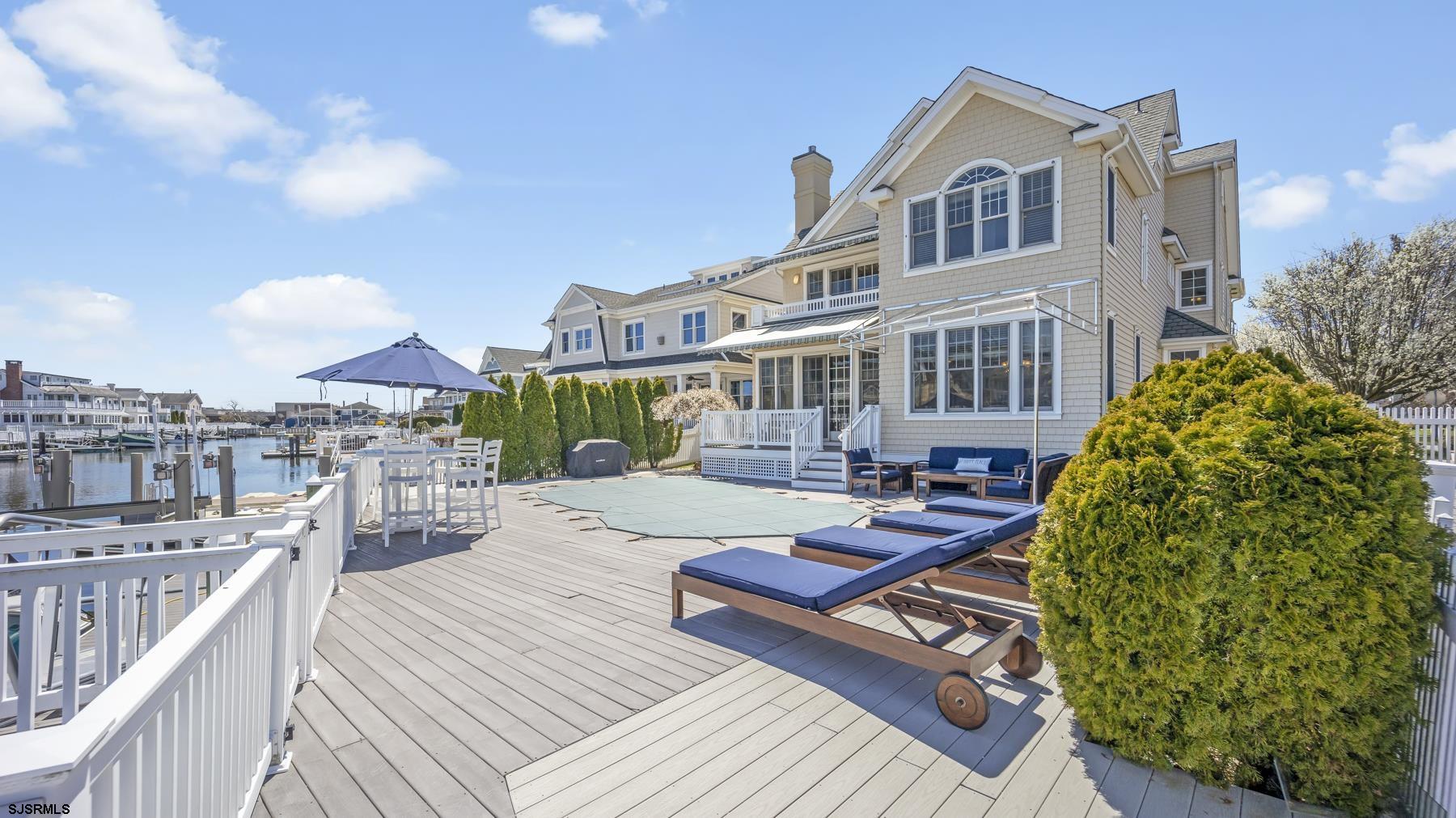 23 Walnut Road Ocean City, NJ 08226 - Photo 8 of 47 a view of a house with backyard and sitting area