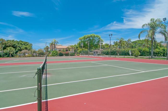 6415 Midnight Pass Road, Unit 210 Sarasota, FL 34242 - Photo 24 of 25 Three lighted tennis courts