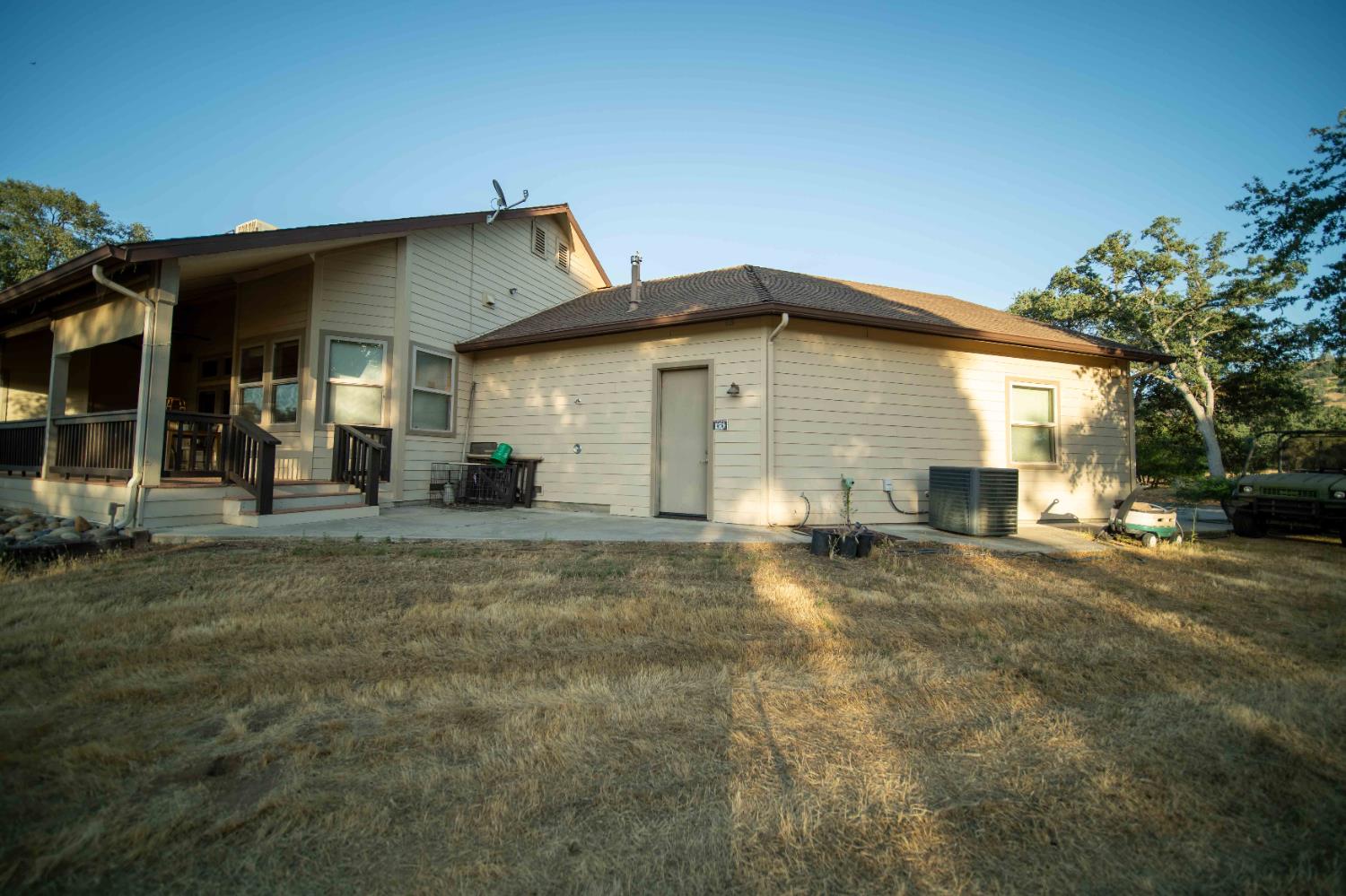26027 Auberry Road Clovis, CA 93619 - Photo 11 of 46 a view of a house with a yard
