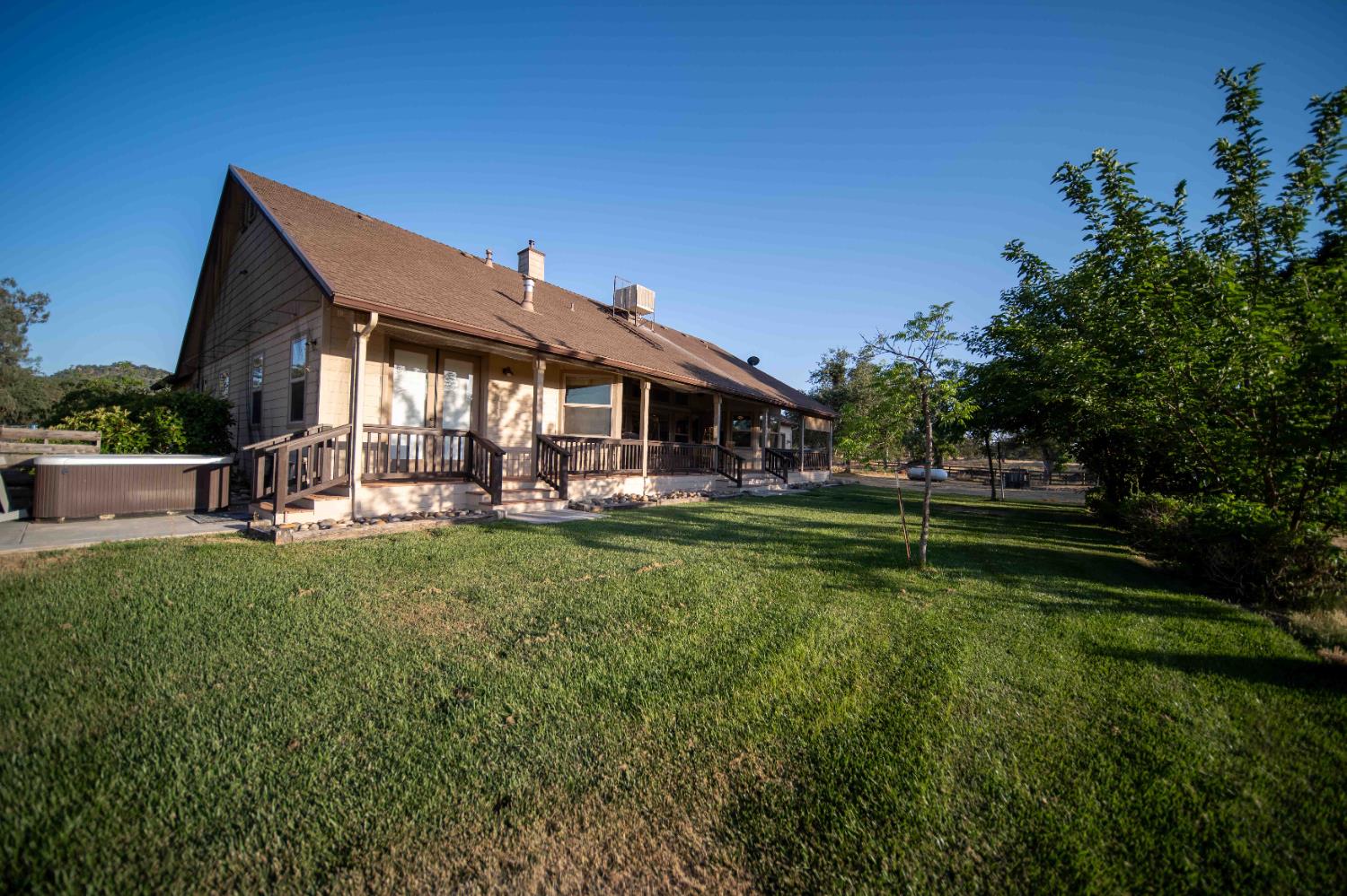 26027 Auberry Road Clovis, CA 93619 - Photo 14 of 46 a front view of house with yard and outdoor seating