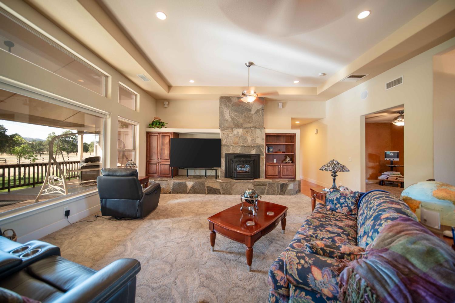 26027 Auberry Road Clovis, CA 93619 - Photo 15 of 46 a living room with furniture and a flat screen tv