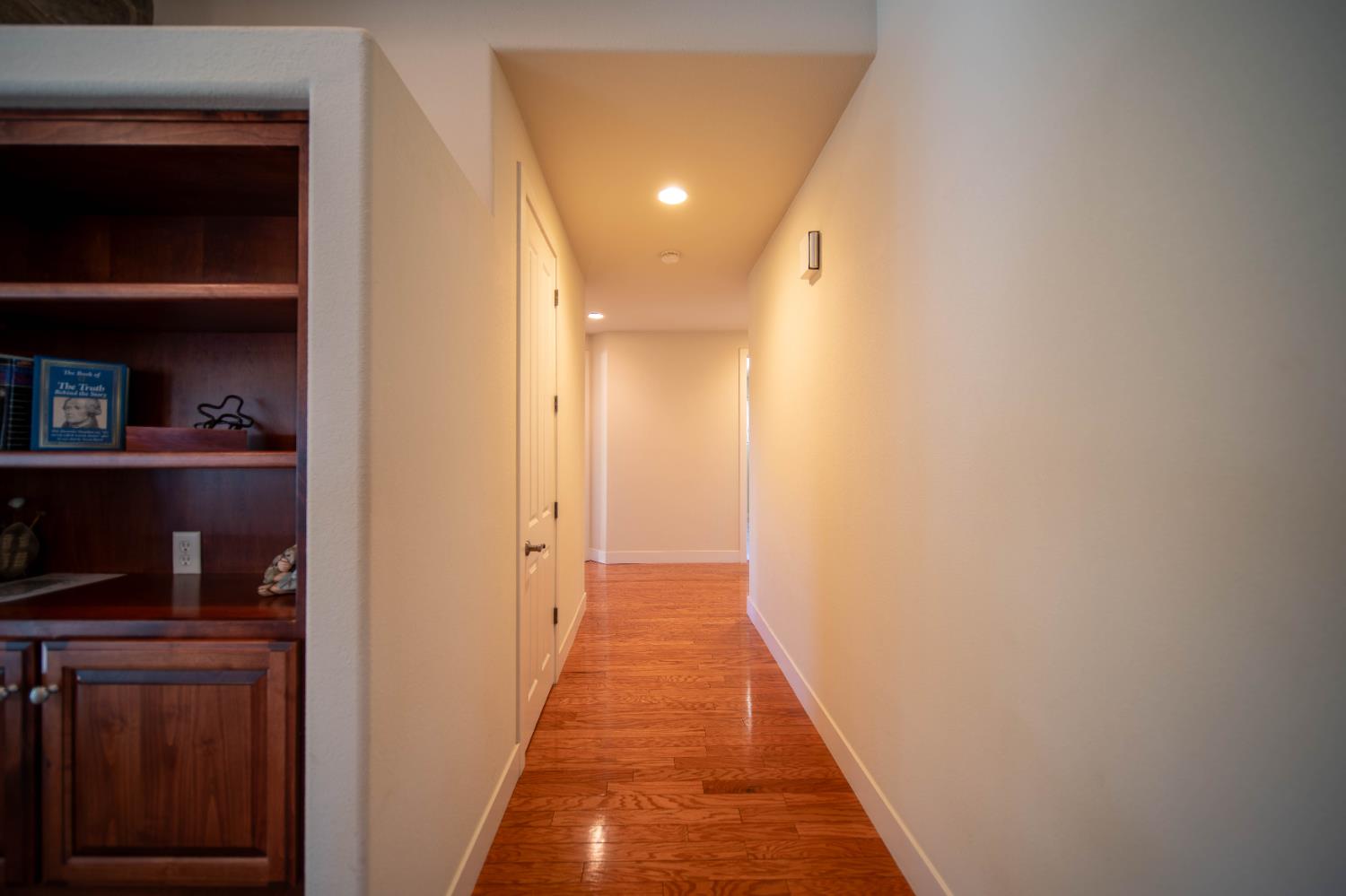 26027 Auberry Road Clovis, CA 93619 - Photo 20 of 46 a view of a hallway with wooden floor and closet