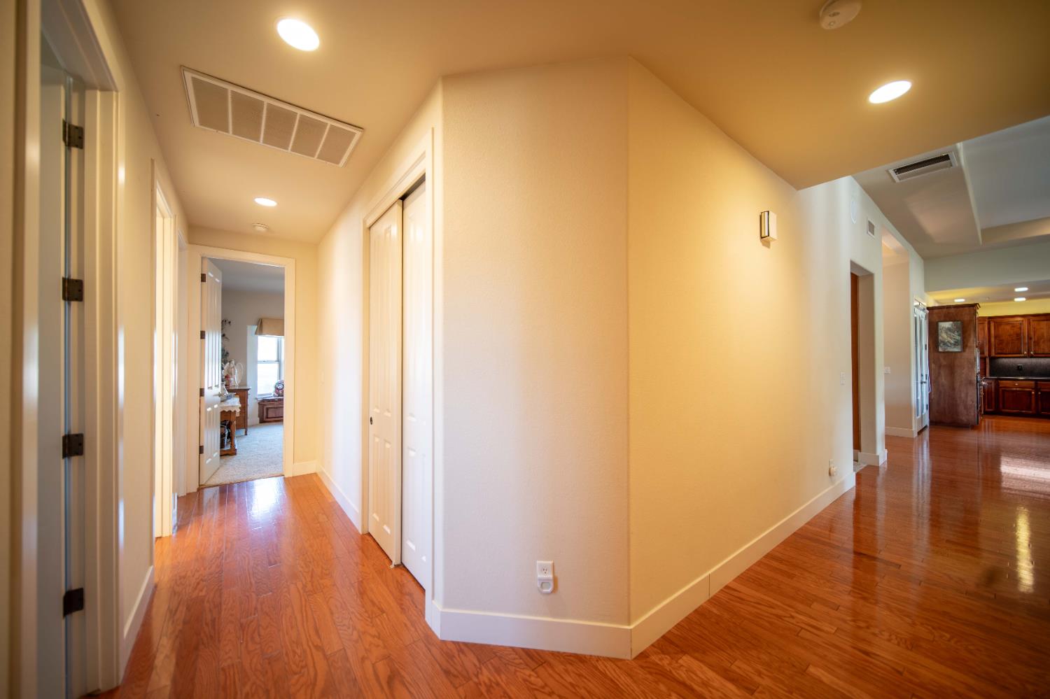 26027 Auberry Road Clovis, CA 93619 - Photo 21 of 46 a view of a hallway with wooden floor
