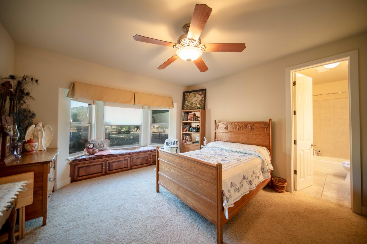 26027 Auberry Road Clovis, CA 93619 - Photo 31 of 46 a bedroom with a bed and a large window