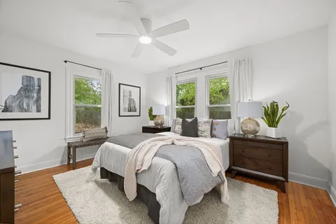 a bedroom with a bed and a couch