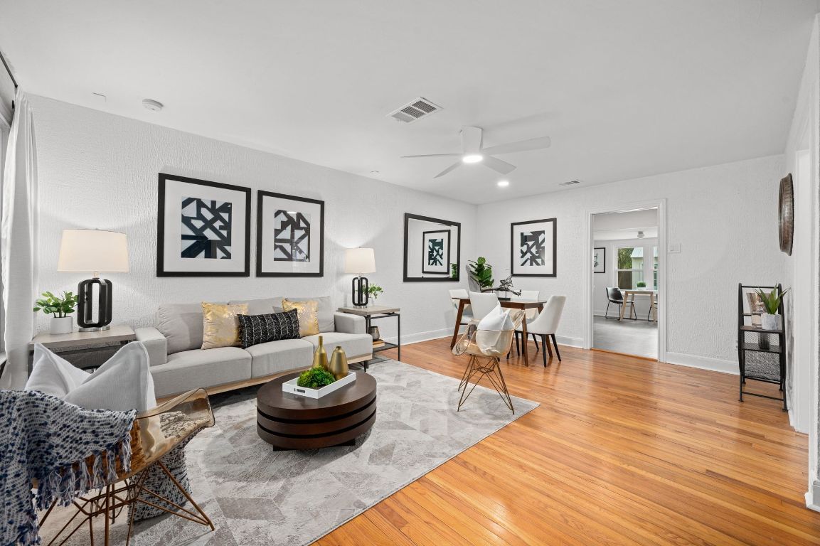 1412 Palo Duro Road Austin, TX 78757 - Photo 3 of 32 a living room with furniture and a wooden floor