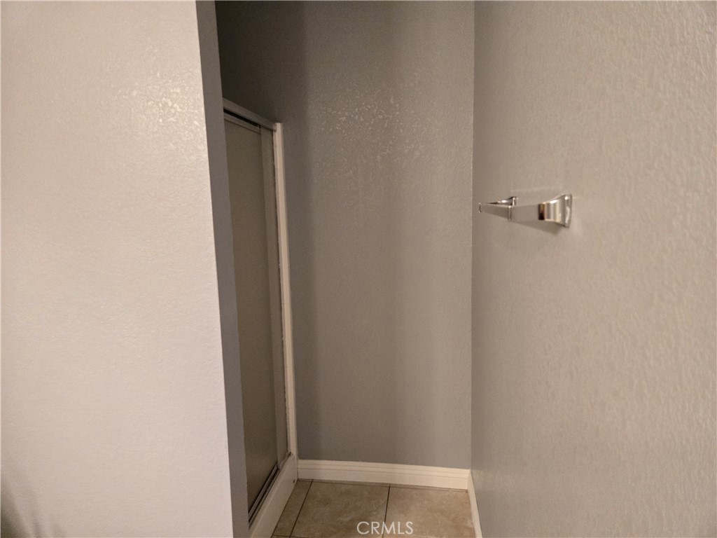 6467 Oak Hill Road, Unit B Oak Hills, CA 92344 - Photo 7 of 12 a view of bathroom with shower