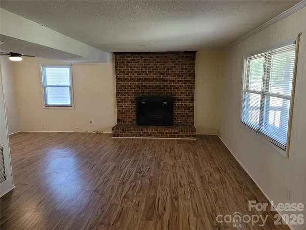 an empty room with wooden floor and closet
