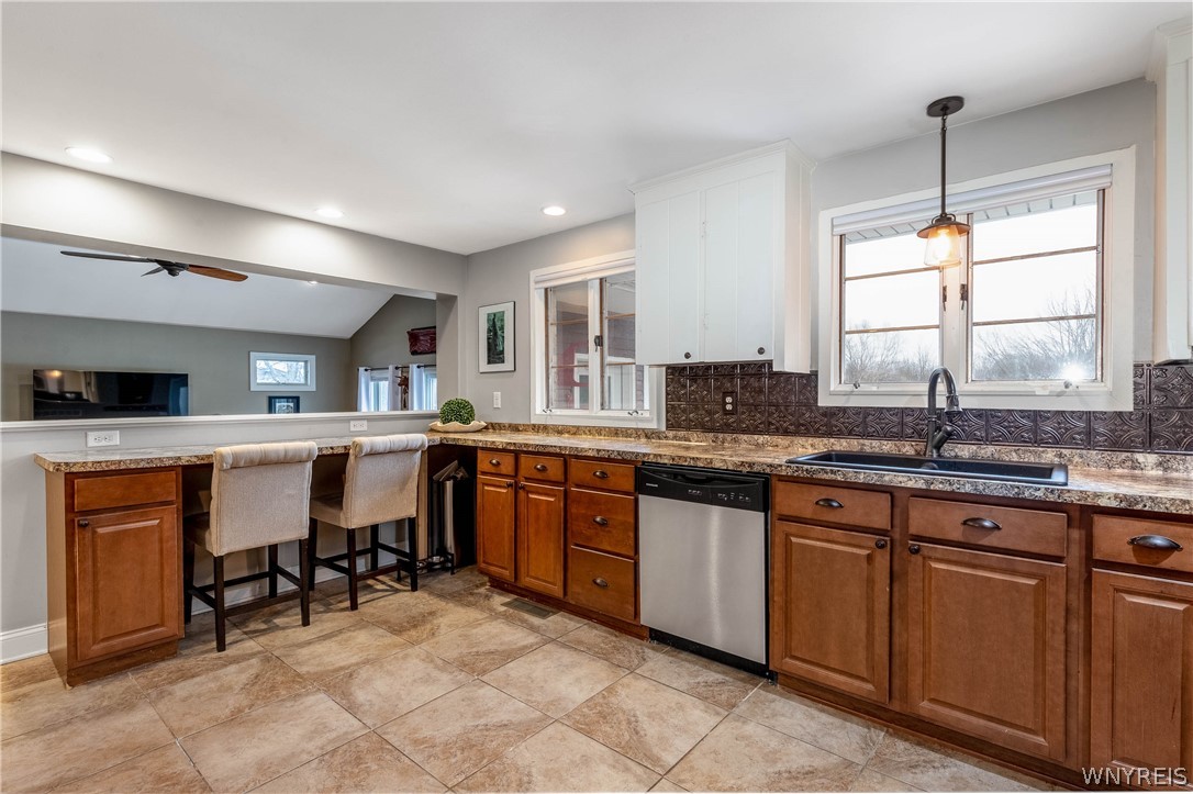 6606 Gartman Road Orchard Park, NY 14127 - Photo 12 of 50 Breakfast bar, Ceramic tile flooring, loads of cou