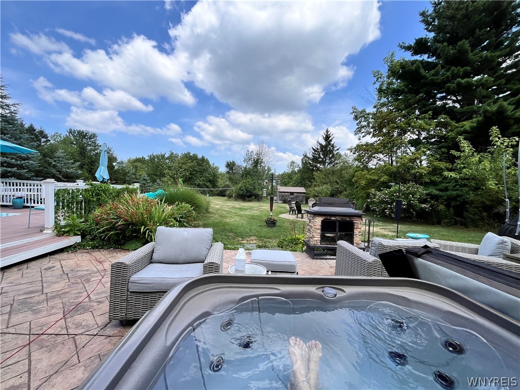 6606 Gartman Road Orchard Park, NY 14127 - Photo 45 of 50 Hottub stays on Stamped Concrete Patio.