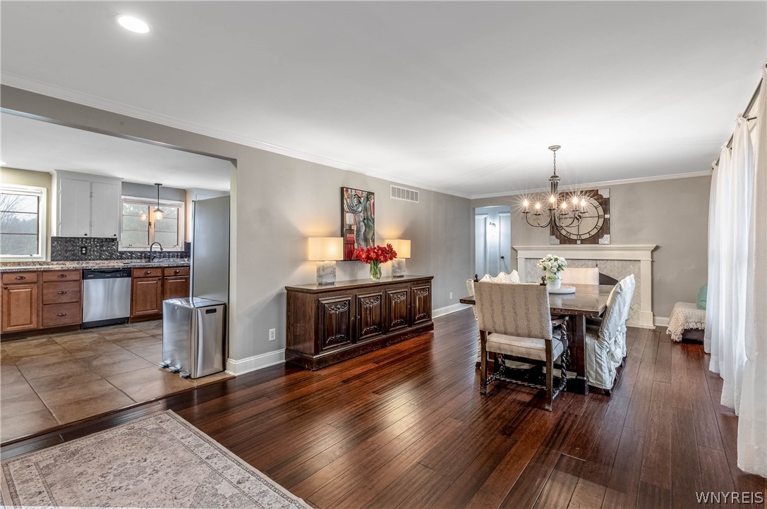 6606 Gartman Road Orchard Park, NY 14127 - Photo 7 of 50 Dining room with gas fireplace.