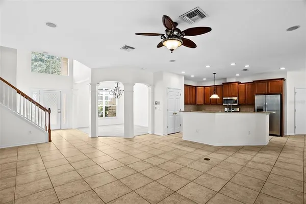 a kitchen with stainless steel appliances granite countertop a stove a sink and a refrigerator